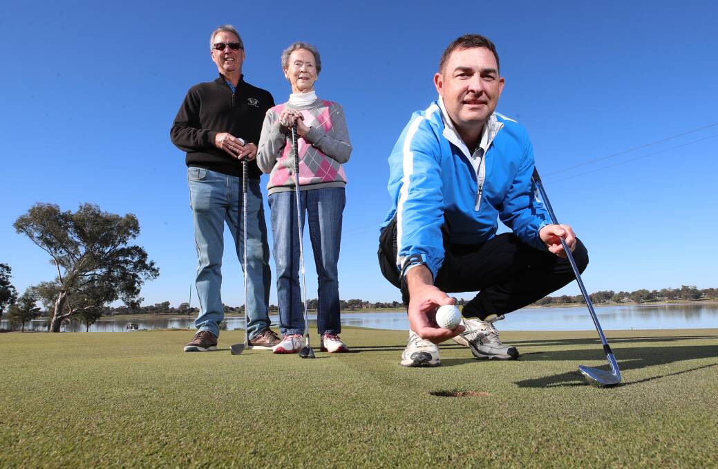 Paul Castle, Claire Castle-Slater and Michal Castle at the 18th hole at the Wagga Country Club. Picture: Les Smith