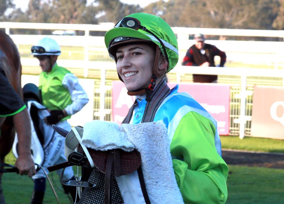 ALL SMILES: Wagga apprentice jockey Hannah Williams after guiding
Magnavale to victory in the Kooringal Stud Wagga Town Plate Prelude
(1200m) at Murrumbidgee Turf Club on Sunday. Picture: Les Smith
