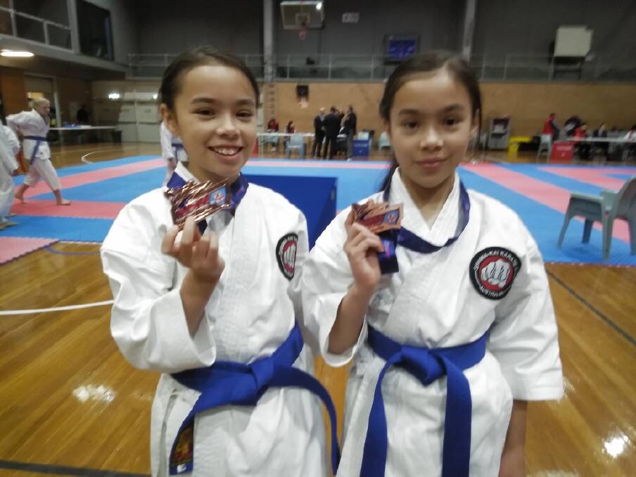 SUCCESS: Safiah and Jamilah Sawal show off the medals they won at the NSW Open Karate Championships in Sydney last weekend.