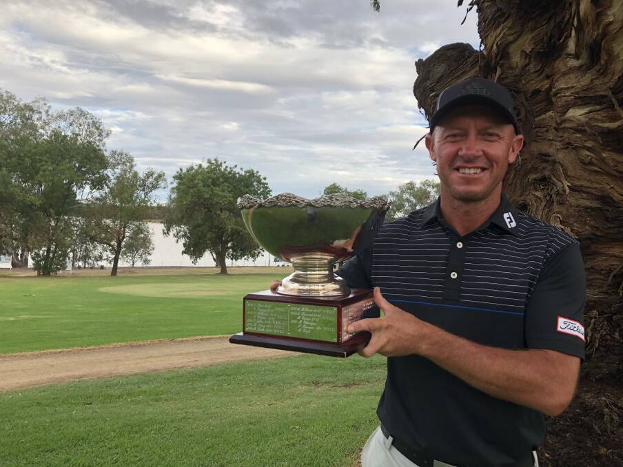 SPECIAL MOMENT: Nathan Green shows off the Wagga Pro-Am trophy after his win at Wagga Country Club on Friday. Picture: Matt Malone
