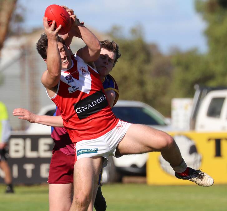 STRONG: Collingullie-Glenfield Park's Daniel Frawley marks in front of Ganmain-Grong Grong-Matong's Max McCaig at Crossroads Oval on Saturday. Pictures: Les Smith