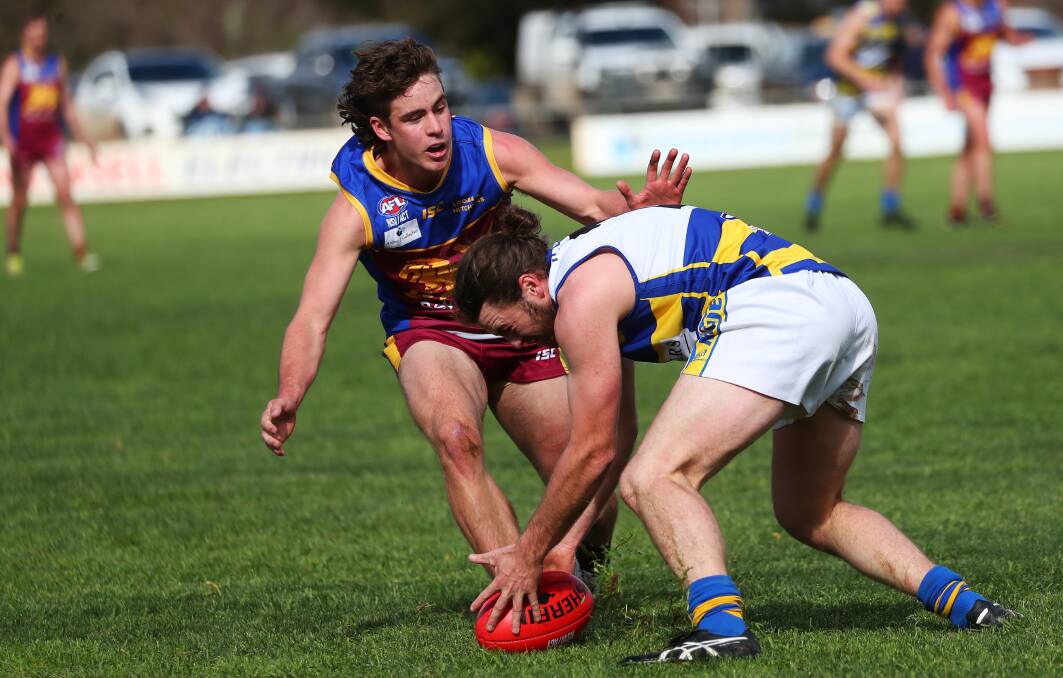 Ganmain-Grong Grong-Matong's Matt Hamblin looks to tackle Mangoplah-Cookardinia United-Eastlakes' Paddy Griffin at Ganmain Sportsground in round five. Picture: Emma Hillier