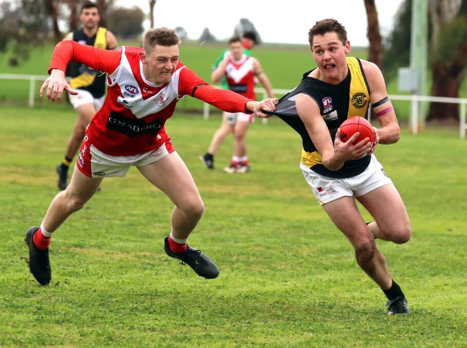 GOTCHA: Wagga Tigers' Nick Ryan tries to escape Collingullie-Glenfield Park's Zane Bolger at Crossroads Oval on Saturday. Picture: Les Smith