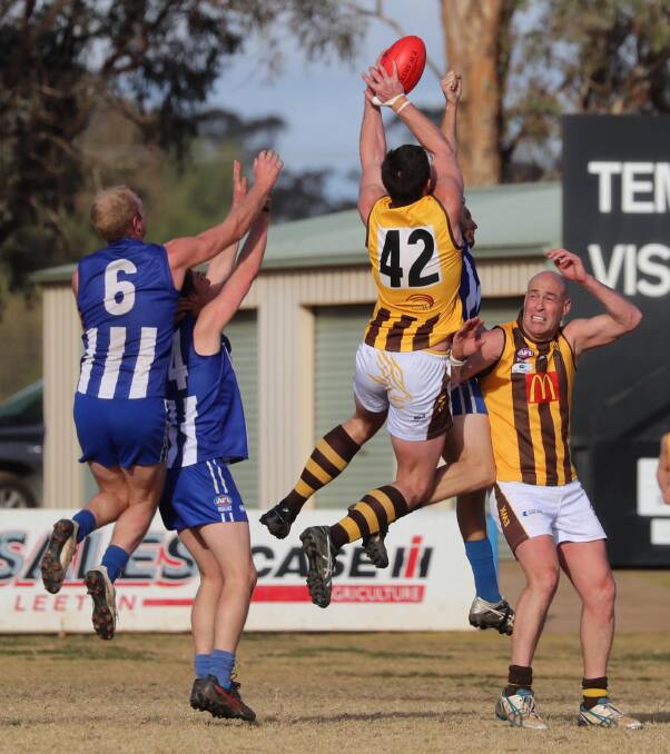 Chris Jackson gets a front row seat to a big Nick Hull mark against Temora earlier in the year.