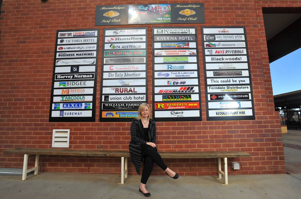 Michelle Merrylees at Murrumbidgee Turf Club's 100 Club board back in 2012.