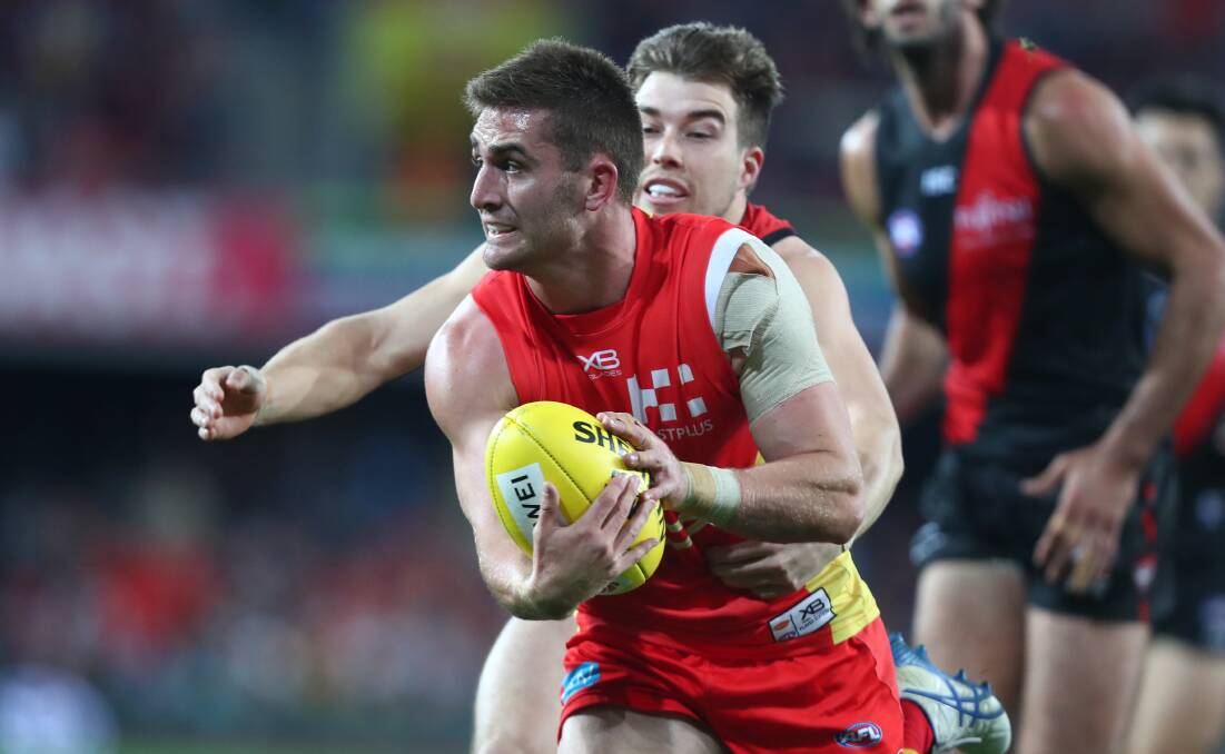 BIG SIGNING: Howlong product Anthony Miles in action for Gold Coast against Essendon. Picture: Gold Coast Suns