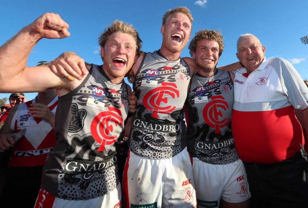 FAMILY AFFAIR: Matt, Ben and Jayden Klemke celebrate their first Riverina League premiership together with grandfather Ian. Picture: Les Smith