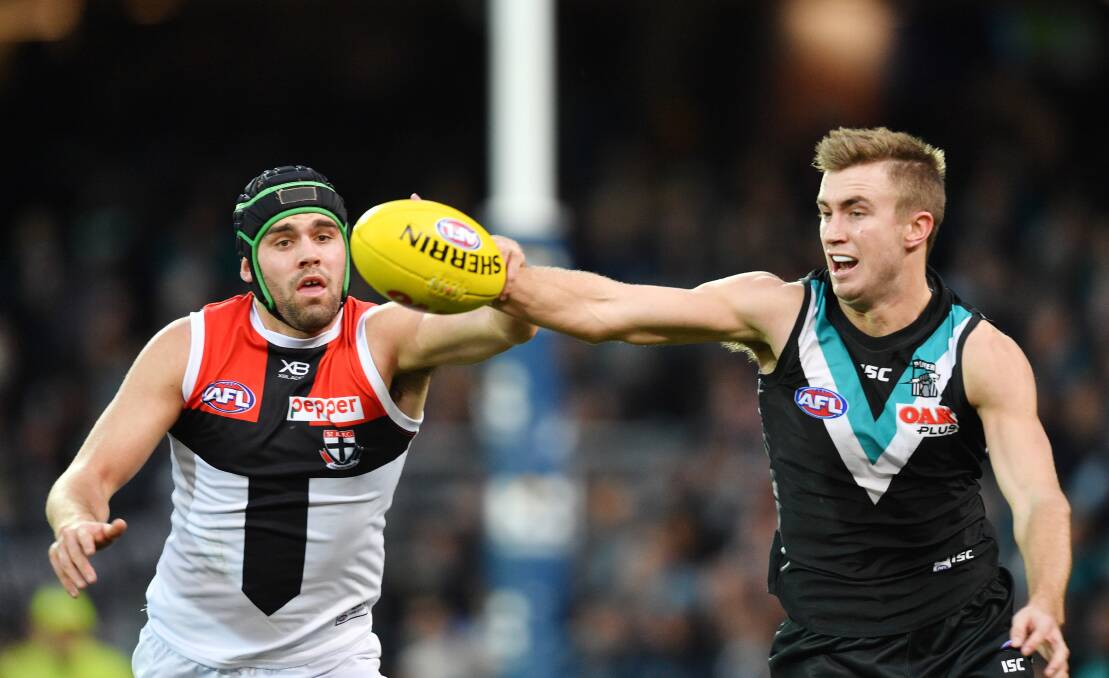 GOING GREAT: Dougal Howard (right) competes for the ball with St Kilda's Paddy McCartin at Adelaide Oval earlier this month.