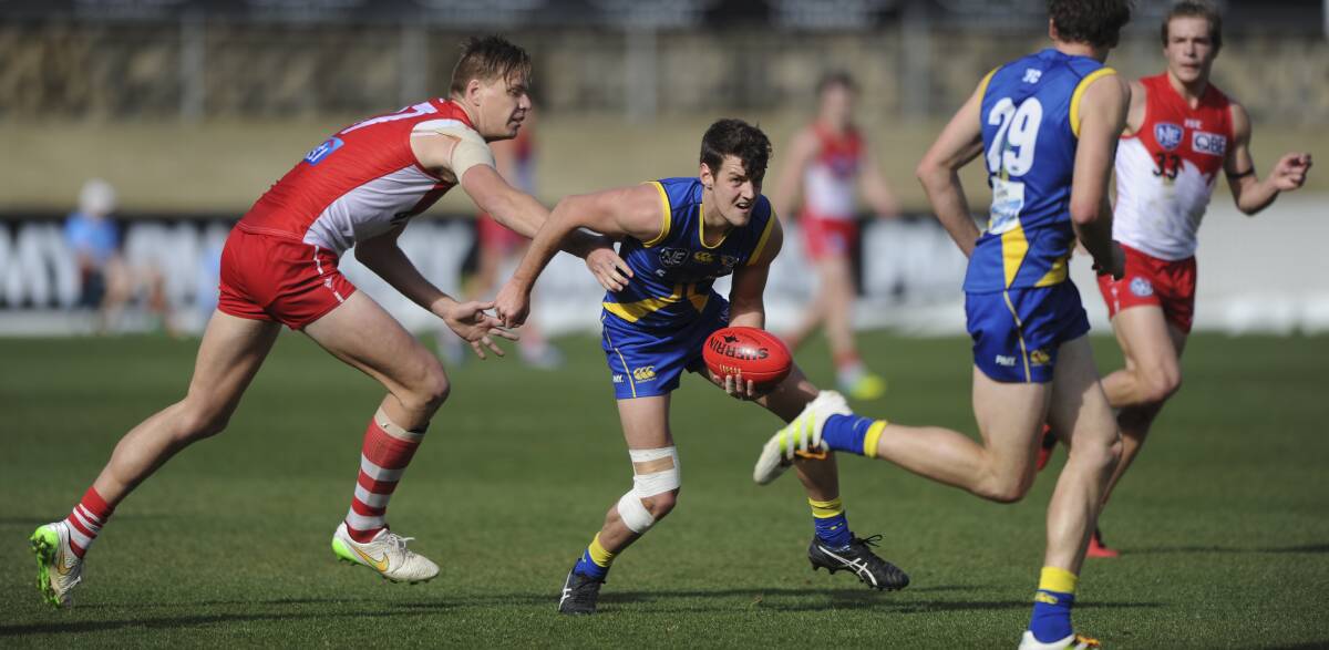 CLASS: Nick Collins in action for Canberra Demons
against Sydney Swans in a 2016 NEAFL game.
Picture: Graham Tidy