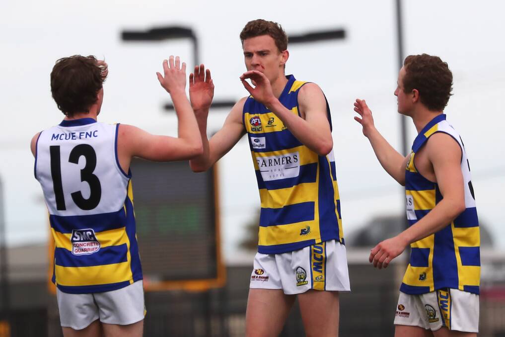 HAPPY DAYS: Mangoplah-Cookardinia United-Eastlakes' Ethan Schiller (left), James Scott (middle) and Charlie Chambers celebrate a goal against Ganmain-Grong Grong-Matong in Sunday's qualifying final at Robertson Oval. Picture: Emma Hillier