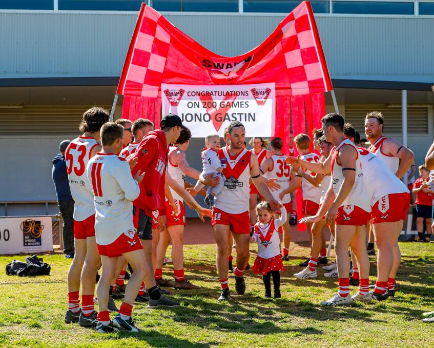 MILESTONE MAN: Griffith celebrate Jono Gastin's 200th game at Exies Oval on Saturday. Picture: Andrew McLean Photography