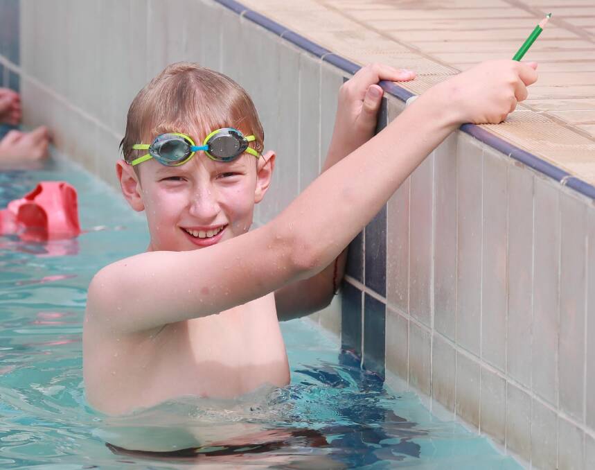 DAY OUT: Will Robertson is all smiles on his way to the senior boy age champion title at Wagga Public School's swimming carnival on Friday. Picture: Les Smith