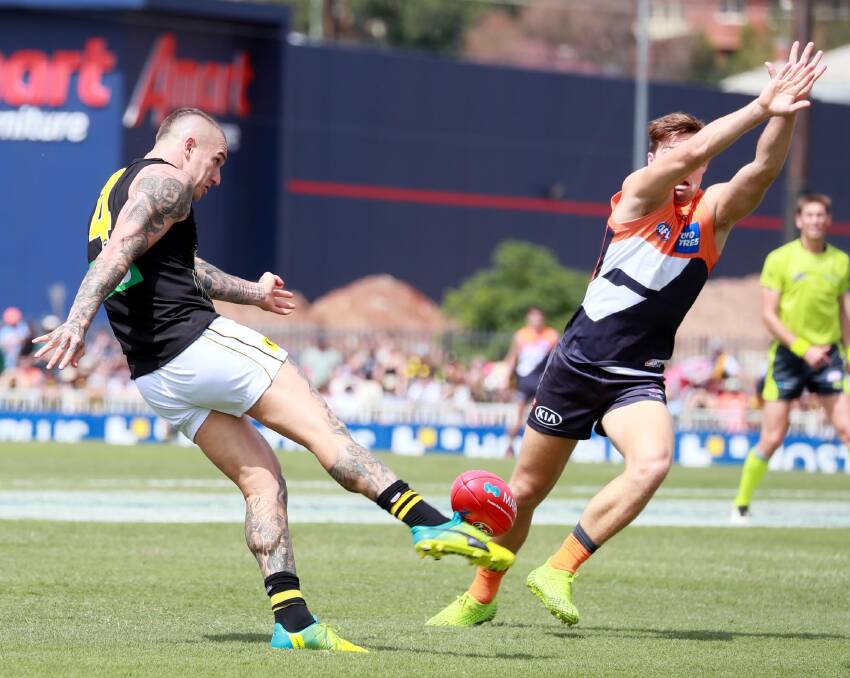 Dusty Martin gets a kick away for Richmond in the game against the Giants in Wagga back in March. Picture: Les Smith
