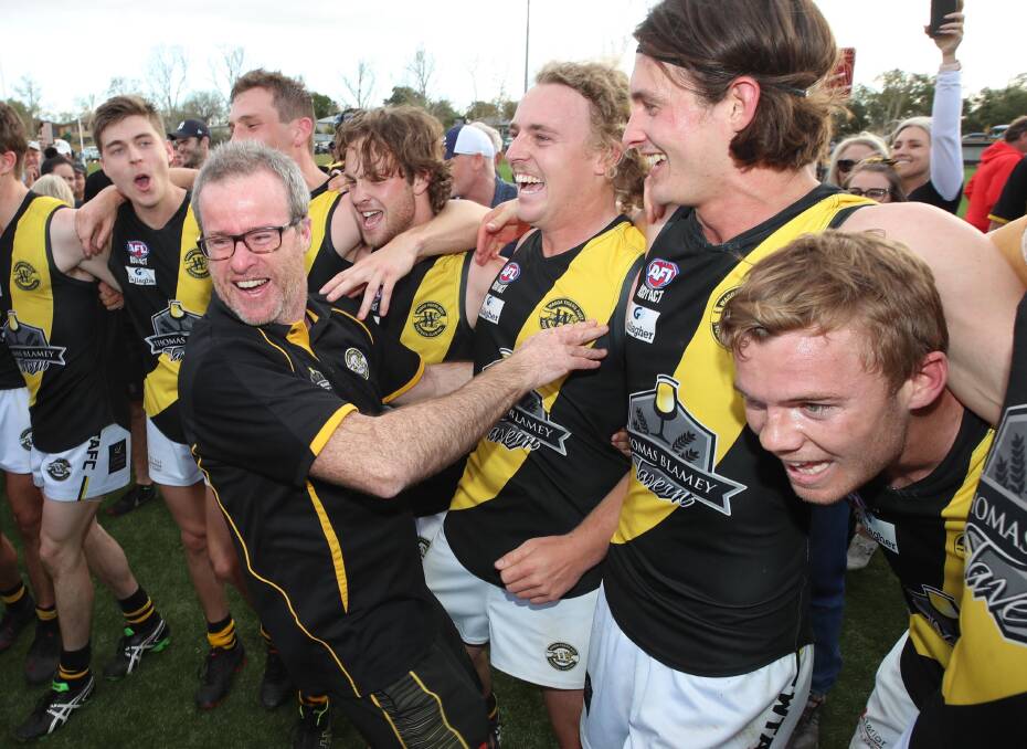 HAPPY DAYS: Wagga Tigers coach Troy Maiden celebrates last year's grand final win with his players. Picture: Les Smith