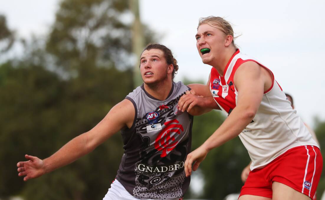 CONTEST: Collingullie-Glenfield Park's Matt Hobbs and Griffith's Nathan Richards compete in the ruck in the Riverina League contest at Crossroads Oval. Picture: Emma Hillier