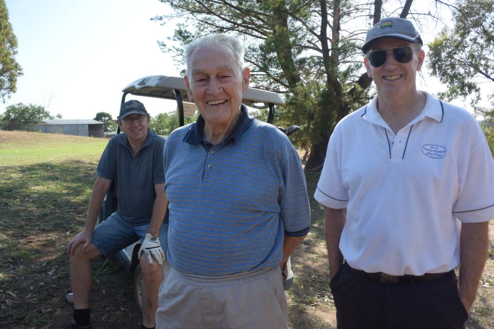 A MARVEL: Bert Adams (centre) with his son Bill (left) and Grahame Winson at Wagga City Golf Club on Monday. Picture: Matt Malone
