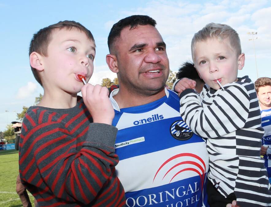 Outgoing coach Ben Schreiber with Archie and Patrick after the 2020 premiership success. Picture: Les Smith