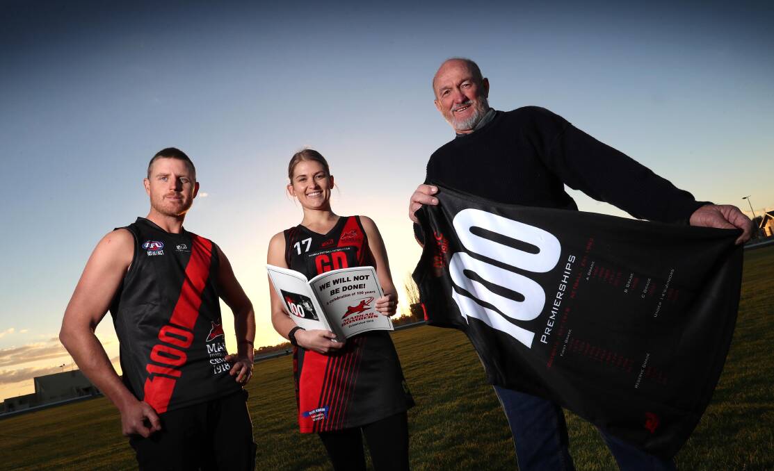 GOING STRONG: Marrar captain Josh Hagar, club legend Reg Hamilton and netball president Sophie McRae show off their uniforms for Saturday as part of the Bombers' centenary celebrations. Picture: Les Smith