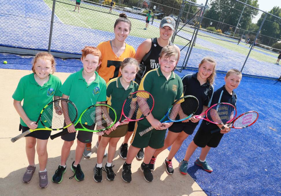 HAVING A BALL: Kaitlin Staines (back right) and University of Tennessee teammate Gabby Schuck with Lutheran Primary School's Perle Grintell and Alex Gunn, North Wagga Public School's Amelia Bowen and Harris Eyles and Wagga Public School's Stella Bennett and Nico Hutchings at South Wagga Tennis Club on Thursday. Picture: Les Smith