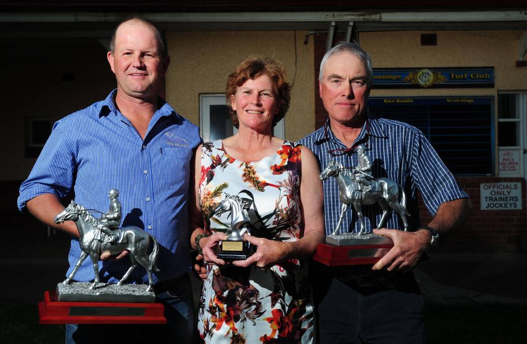 Chris Heywood, trainer of High Opinion, and Kathy Blay and Jim Scobie show off the SDRA Horse of the Year trophy in 2016.