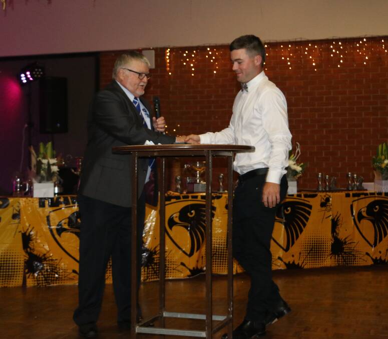 PRESENTATION: David Oehm presents the Gerald Clear Medal to Harry Fitzsimmons on Friday night.