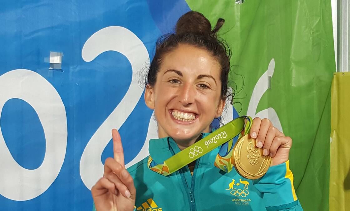 NUMBER ONE: Wagga's Alicia Quirk shows off her new gold medal after helping Australia to victory in the Women's Rugby Sevens in Rio.