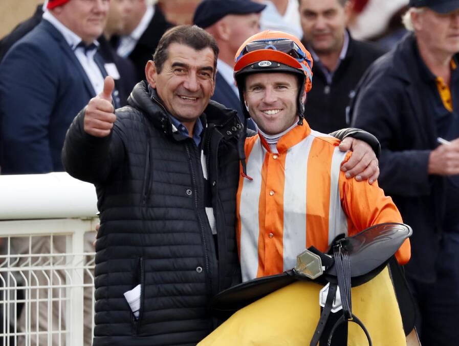 ALL SMILES: Canberra trainer Gratz Vella and jockey Tommy Berry after winning the Queen of the South with Crucial Witness. Picture: Les Smith