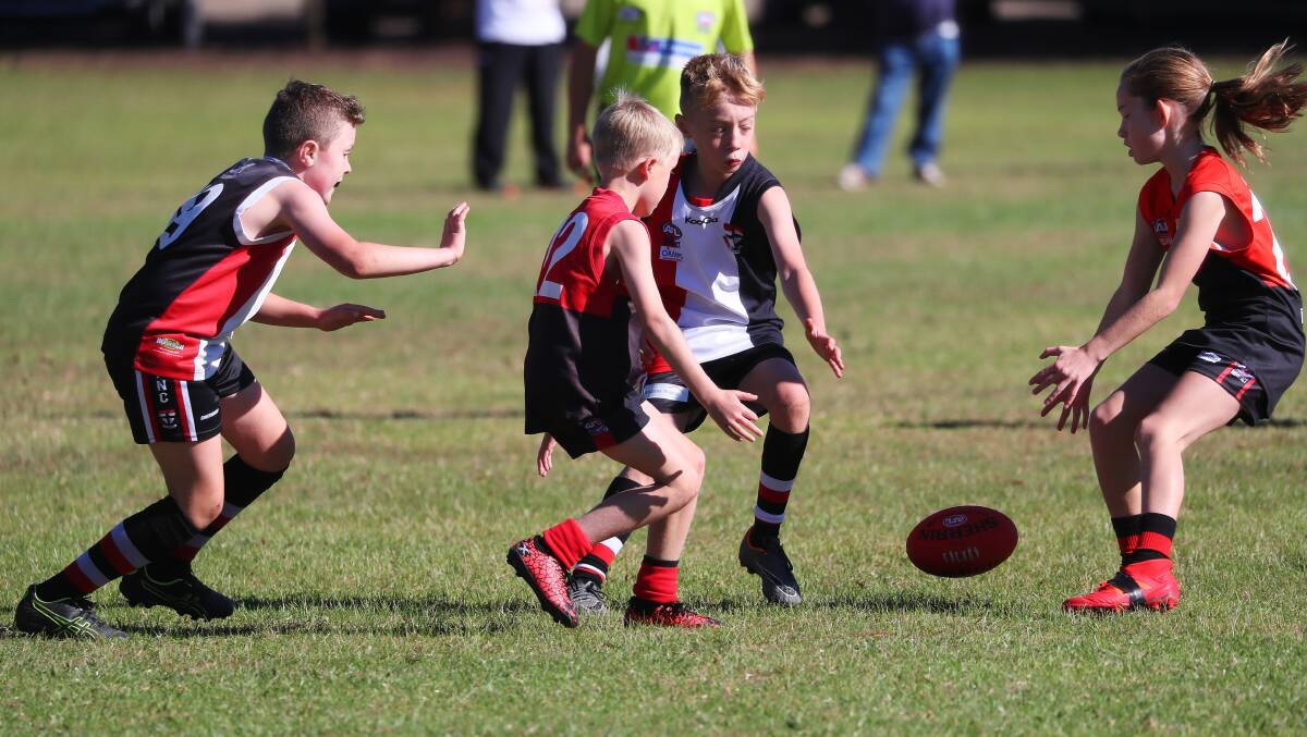 Wagga Swans and North Wagga battle it out in an under 10 Wagga and District junior game at Anderson Oval last year. Picture: Emma Hillier
