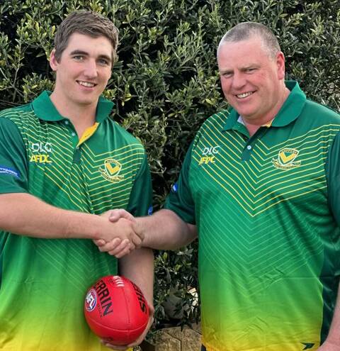 New North Albury recruit Brad Hutchison is welcomed on board by recruiting committee member Eryn Knobel on Tuesday. Picture supplied