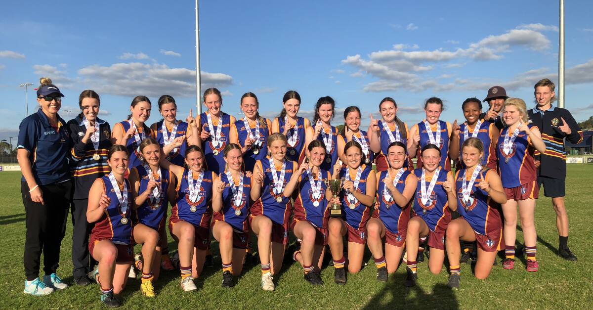 CHAMPIONS: Mater Dei Catholic College's open girls team celebrate their win over The Riverina Anglican College (TRAC) on Wednesday. Picture: Matt Malone