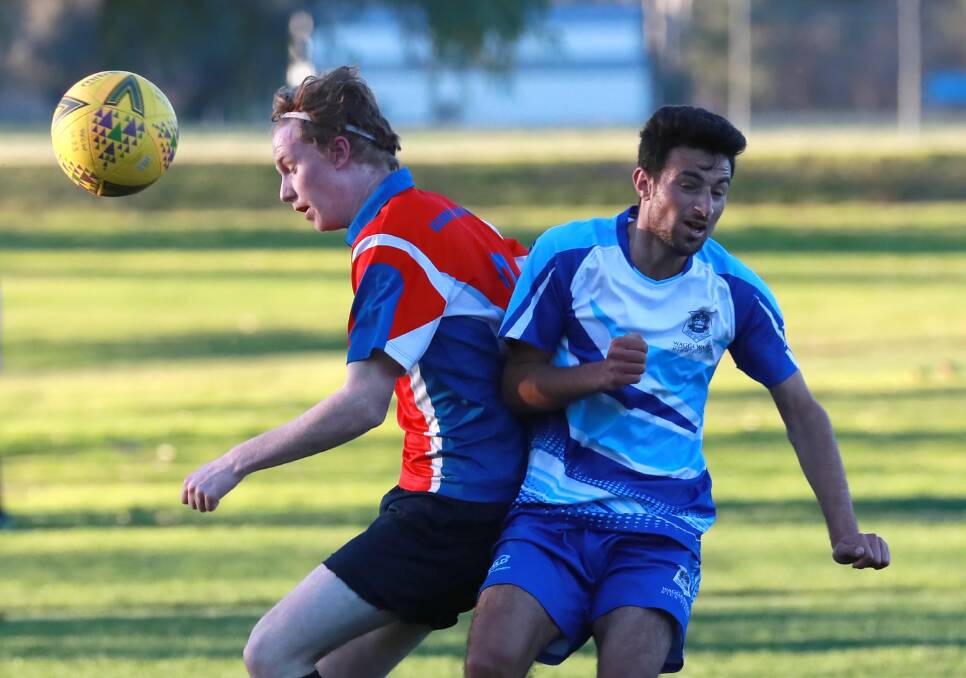 STRONG CONTEST: Kildare Catholic College's Joshua Timothy-Nesbitt and Wagga High School's Rasheed Sharkan collide during the Creed Shield semi-final at Rawlings Park on Wednesday evening. Picture: Les Smith