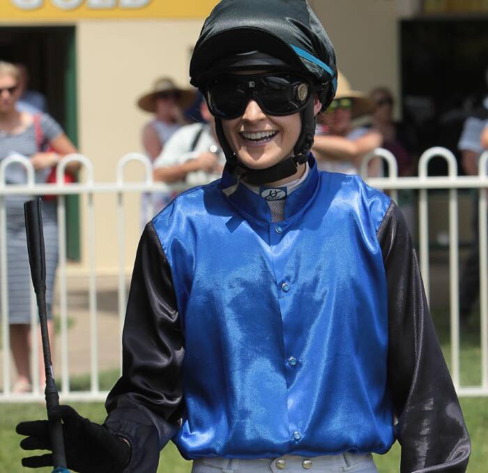CAREER CHANGE: Leeton apprentice jockey Kristen Smart is all smiles at Gundagai last Friday after a winning double. Smart is off to university this year. Picture: Les Smith