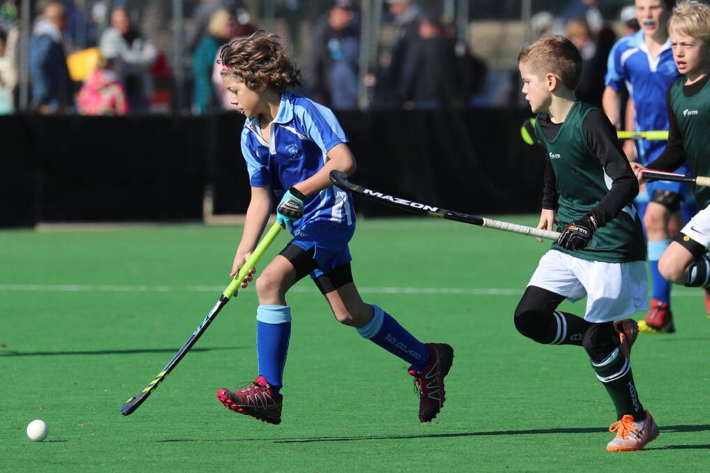 SHOOSH: Jarrod Frost and Fergus O'Callaghan in action at the under 13 hockey championships in Wagga last year. Picture: Les Smith