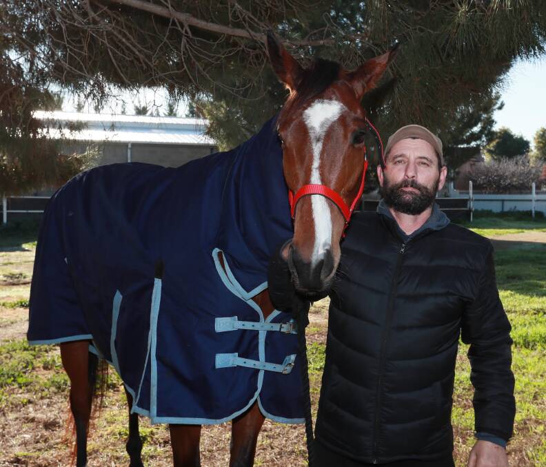 HAPPY DAYS: Russ Steiner with Skyschiller on Friday. The mare will have her second start for the stable at Narrandera on Saturday. Picture: Les Smith