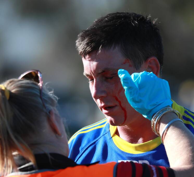 TOUGH YEAR: Junee captain-coach Trent Schubach gets treated to in last Saturday's loss to Gundagai at Laurie Daley Oval. Picture: Les Smith