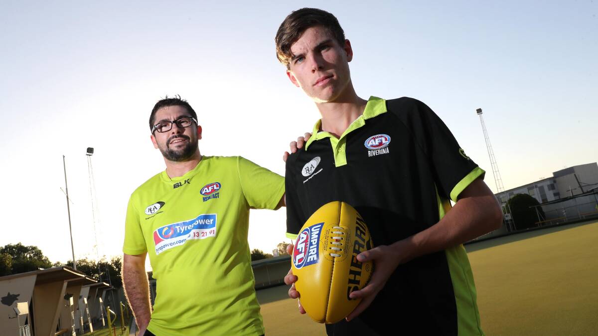 FOR THE GOOD OF THE GAME: Riverina Umpires Association (RUA) president Ryan Dedini with young umpire Braydon McClintock back in 2018. Picture: Les Smith