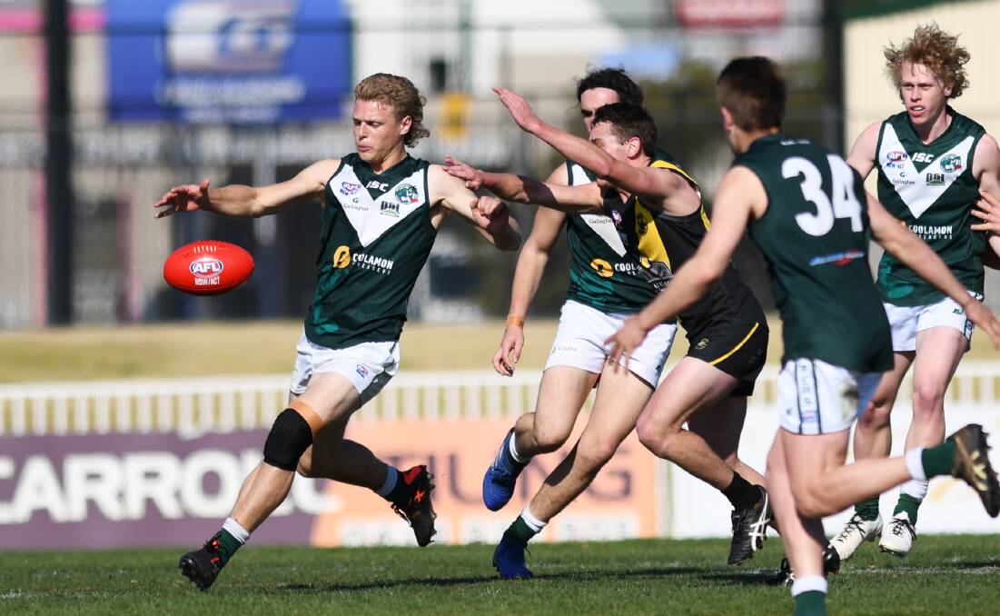 BRING IT ON: Coolamon's Jeremiah Maslin gets a kick away in a
Riverina League game against Wagga Tigers late last year.
AFL Riverina hope to get a 2020 season underway in some format.