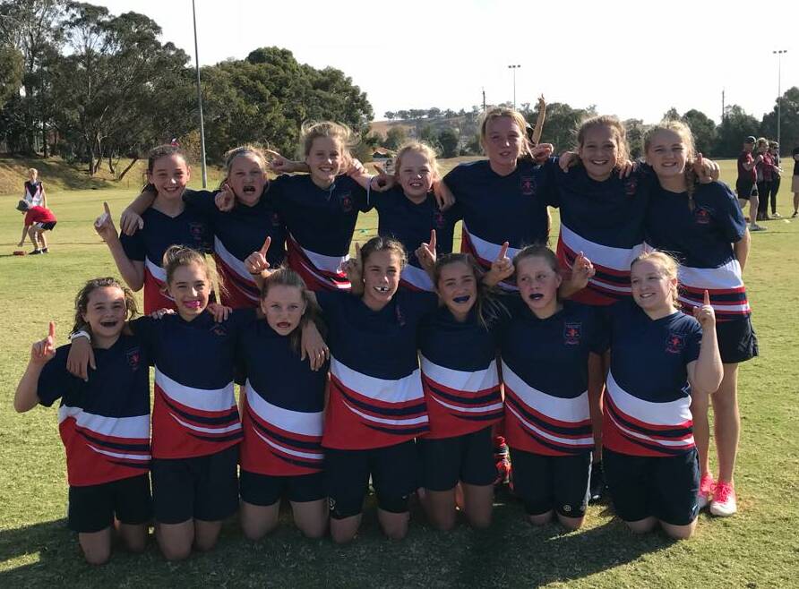 ALL SMILES: Mater Dei Catholic College's girls team celebrate their success at the Paul Kelly Cup day at Jubilee Park on Wednesday. Picture: Sarah Braybon