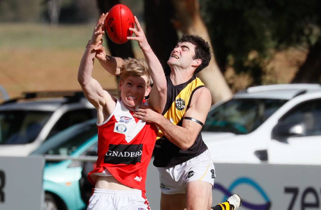 Ben Kelly competes for Wagga Tigers against Collingullie full-forward Sam Stening this season. Picture by Les Smith