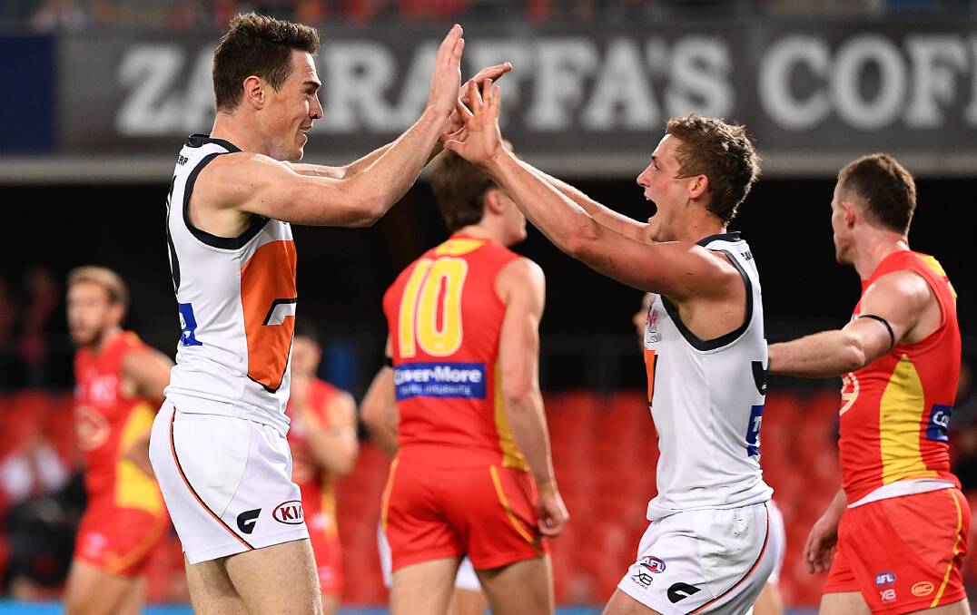 Jeremy Cameron and Harry Perryman celebrate a goal against Gold Coast in the last round. Picture: AAP