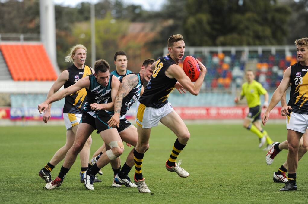 NEW ROO: Joseph Tegart in action for Queanbeyan in the 2015 AFL Canberra grand final. He has signed with Farrer League club Temora for the remainder of the season. Picture: The Canberra Times