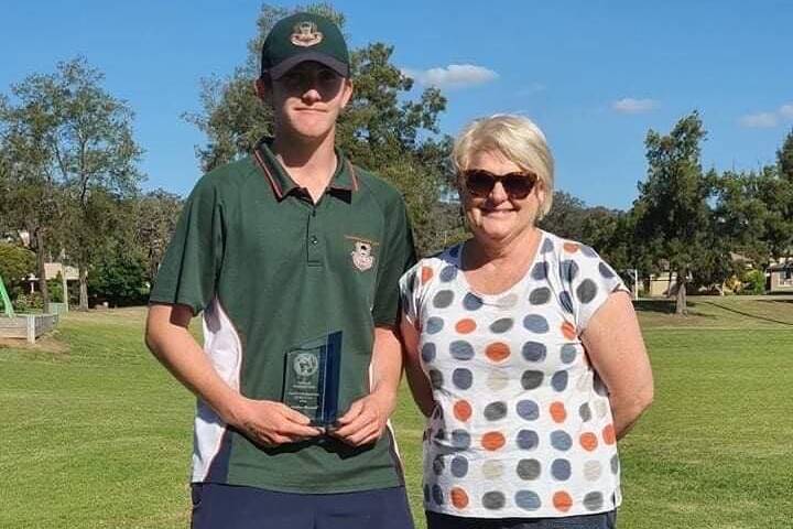 BIG FUTURE: Nathan Mitchell is presented the Donna O'Grady Junior Clubperson of the Year by Donna O'Grady. Picture: Tolland Wolves FC