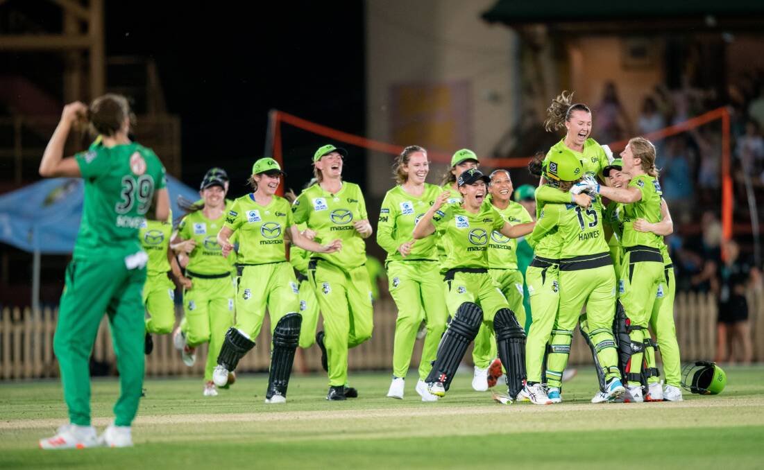 JUBILATION: Wagga's Rachel Trenaman is thrown into the air by teammates as Sydney Thunder celebrate their WBBL final win at North Sydney Oval on Saturday night. Picture: Getty Images