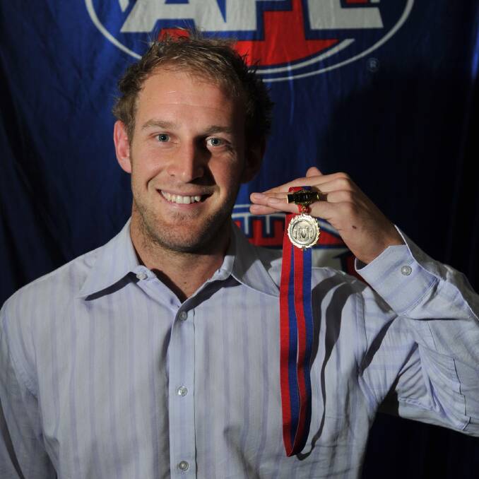 Guy Orton with the 2011 Jim Quinn Medal