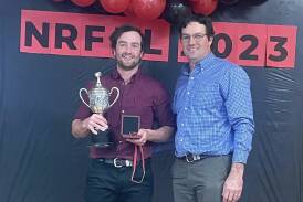 Hillston's Neil Macfarlane is presented Northern Riverina's league best and fairest on Wednesday night by league president Mark Bryant. Picture supplied