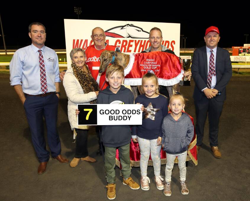 The connections of Good Odds Buddy celebrate this year's Wagga Gold Cup win with the Hull family and Wagga and District Greyhound Racing Club officials. Picture: Les Smith