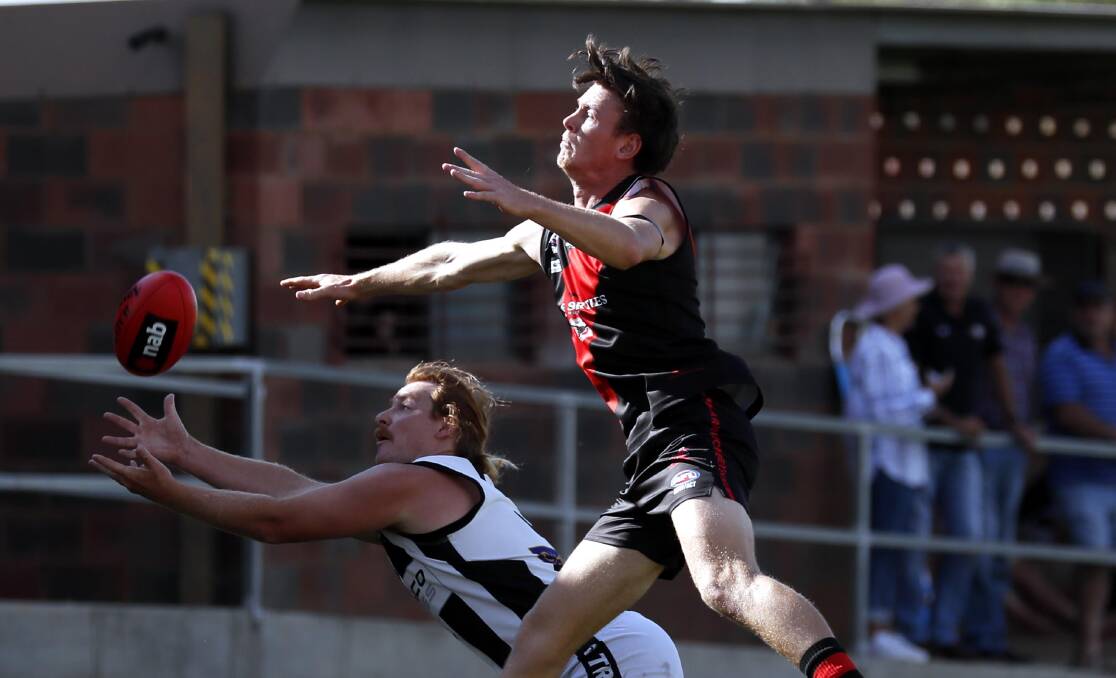 IN TROUBLE: The Rock-Yerong Creek's Harri White looks to mark against Marrar's Zac Lewis earlier in the season. White will miss Saturday's qualifying final due to suspension. Picture: Les Smith