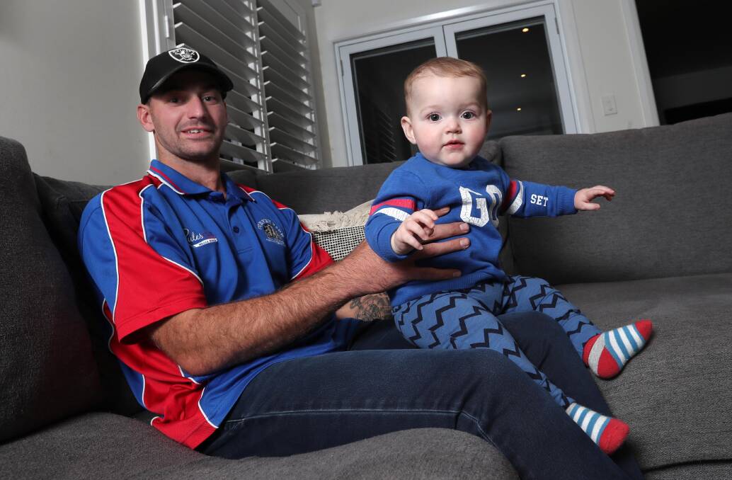HAPPY DAYS: Turvey Park midfielder Josh Ashcroft at home with seven-month old son Jax on Thursday ahead of Saturday's big game against Leeton-Whitton. Picture: Les Smith