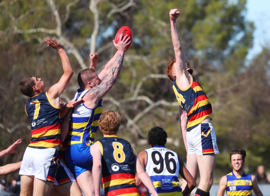 STRONG: MCUE full-forward Brent Arho takes a big pack mark early in the elimination final against Leeton-Whitton on Sunday. Picture: Emma Hillier