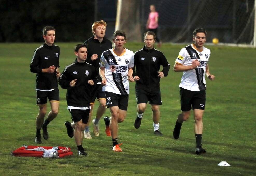 Wagga City Wanderers go through their paces at Gissing Oval on Thursday night.